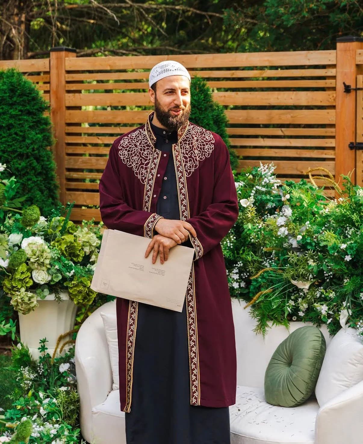Imam Zaniar Ahmad holding ceremony documents after a wedding